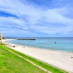 Beautiful, Modern Apartment Seconds From Beach